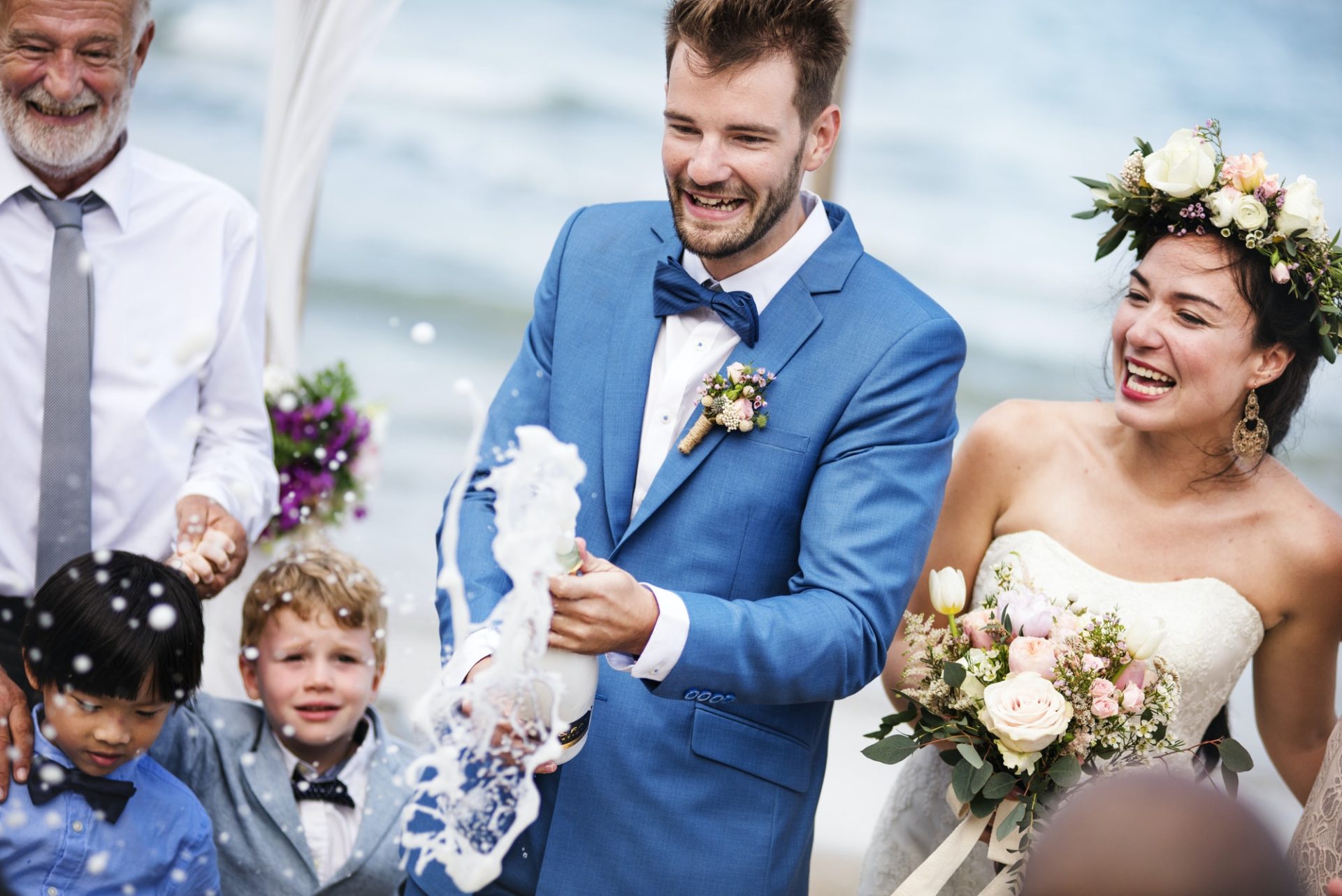 young-couple-in-a-wedding-ceremony-at-the-beach-e1630316228823.jpg